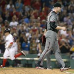 
              Arizona Diamondbacks' Archie Bradley walks on the mound after giving up a two-run home run to Boston Red Sox's Brock Holt, left, during the sixth inning of a baseball game in Boston, Saturday, Aug. 13, 2016. (AP Photo/Michael Dwyer)
            