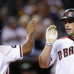 Arizona Diamondbacks' Paul Goldschmidt (44) celebrates his two-run home run against the Atlanta Braves with Michael Bourn during the seventh inning of a baseball game Wednesday, Aug. 24, 2016, in Phoenix. (AP Photo/Ross D. Franklin)