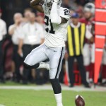 
              Oakland Raiders defensive back Sean Smith reacts after breaking up a pass during the first half against the Arizona Cardinals in an NFL preseason football game, Friday, Aug. 12, 2016, in Glendale, Ariz. (AP Photo/Rick Scuteri)
            