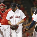 Boston Red Sox's Clay Buchholz, center, leaves the mound after being taken out during the fifth inning of a baseball game against the Arizona Diamondbacks in Boston, Saturday, Aug. 13, 2016. (AP Photo/Michael Dwyer)