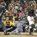 Arizona Diamondbacks' Rickie Weeks scores on a run as San Diego Padres catcher Derek Norris gets out of the way in the eighth inning of a baseball game Friday, Aug. 19, 2016, in San Diego. (AP Photo/Lenny Ignelzi)