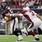 Houston Texans outside linebacker John Simon (51) is pursues by Arizona Cardinals quarterback Carson Palmer (3) after he intercepted a pass during the first half of an NFL preseason football game, Sunday, Aug. 28, 2016, in Houston. (AP Photo/Eric Christian Smith)