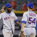 New York Mets' Jose Reyes (7) celebrates with T.J. Rivera (54) after the final out of a baseball game against the Arizona Diamondbacks on Tuesday, Aug. 16, 2016, in Phoenix. The Mets defeated the Diamondbacks 7-5. (AP Photo/Ross D. Franklin)