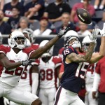 Houston Texans wide receiver Will Fuller (15) reaches for a pass in front of Arizona Cardinals cornerback Brandon Williams (26) during the first half of an NFL preseason football game, Sunday, Aug. 28, 2016, in Houston. Fuller dropped the ball. (AP Photo/Eric Christian Smith)