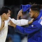 France's Walide Khyar, blue, competes against Brazil's Felipe Kitadai during the men's 60-kg judo competition at the 2016 Summer Olympics in Rio de Janeiro, Brazil, Saturday, Aug. 6, 2016. (AP Photo/Markus Schreiber)