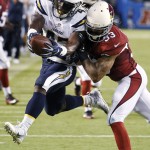 San Diego Chargers running back Branden Oliver, left, is tackled by Arizona Cardinals defensive back Matthias Farley during the second half of a preseason NFL football game, Friday, Aug. 19, 2016, in San Diego. (AP Photo/Denis Poroy)