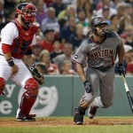 Arizona Diamondbacks' Michael Bourn, right, watches his RBI single in front of Boston Red Sox's Sandy Leon during the fifth inning of a baseball game in Boston, Saturday, Aug. 13, 2016. (AP Photo/Michael Dwyer)