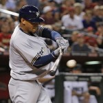 Milwaukee Brewers' Orlando Arcia connects for an RBI single against the Arizona Diamondbacks during the fourth inning of a baseball game Friday, Aug. 5, 2016, in Phoenix. (AP Photo/Ross D. Franklin)