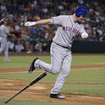 New York Mets' Jay Bruce throws his bat down in frustration as he flies out with runners on base during the third inning of a baseball game against the Arizona Diamondbacks Monday, Aug. 15, 2016, in Phoenix. (AP Photo/Ross D. Franklin)