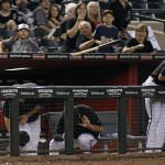 Arizona Diamondbacks' Brandon Drury, far right, and his teammates try to avoid the bat of Ricky Weeks Jr. as it flies into the dugout during the ninth inning of a baseball game against the Cincinnati Reds, Saturday, Aug. 27, 2016, in Phoenix. The Reds defeated the Diamondbacks 13-0. (AP Photo/Ralph Freso)