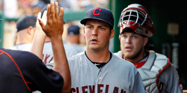 Cleveland Indians starting pitcher Trevor Bauer, center, celebrates after getting a strikeout on Wa...