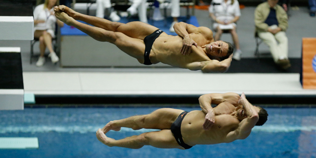 Troy Dumais and Sam Dorman compete during the men's 3-meter synchro springboard diving final at the...