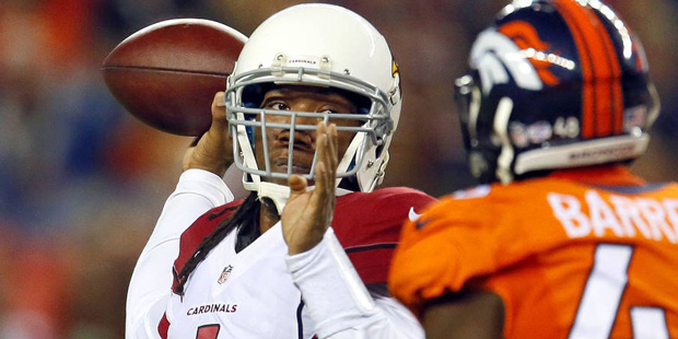 Arizona Cardinals quarterback Phillip Sims (1) throws over Denver Broncos linebacker Shaquil Barret...