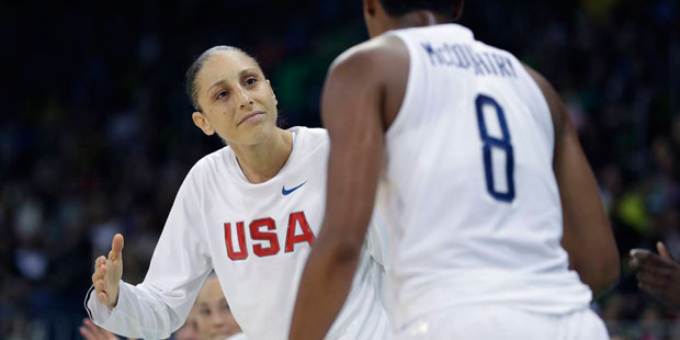 United States guard Diana Taurasi greets teammate Angel McCoughtry after a play during the second h...