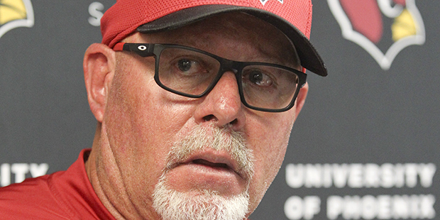 Arizona Cardinals head coach Bruce Arians talks with media members after an NFL football game again...