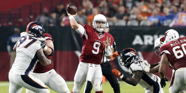 Arizona Cardinals quarterback Matt Barkley (9) throws under pressure from Denver Broncos outside li...