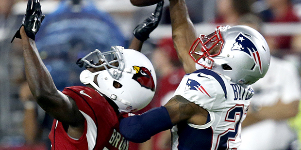 New England Patriots cornerback Malcolm Butler (21) breaks up a pass intended for Arizona Cardinals...