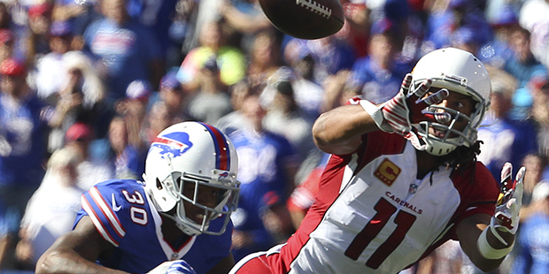 Arizona Cardinals wide receiver Larry Fitzgerald (11) makes a catch in front of Buffalo Bills defen...