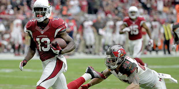 Arizona Cardinals wide receiver Jaron Brown (13) runs after the catch for a touchdown as Tampa Bay ...