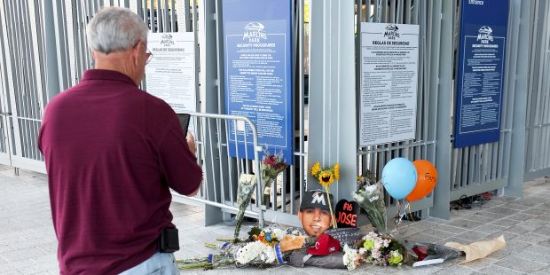 Hector Sanchez takes a photo of a make shift memorial in honor of Jose Fernandez sits outside Marli...