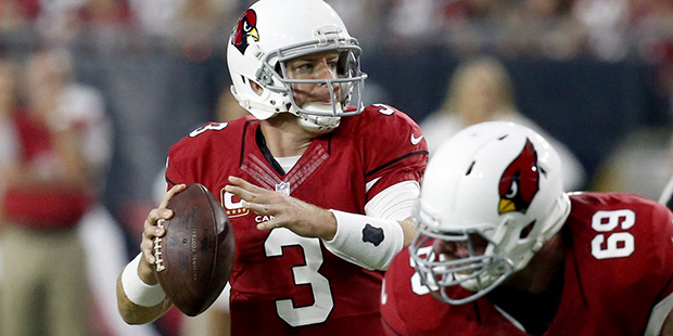 Arizona Cardinals quarterback Carson Palmer (3) looks to throws against the New England Patriots du...
