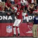 Arizona Cardinals defensive back Marcus Cooper (41) celebrates his touchdown after an interception with teammate cornerback Patrick Peterson (21) against the Tampa Bay Buccaneers during the second half of an NFL football game, Sunday, Sept. 18, 2016, in Glendale, Ariz. (AP Photo/Rick Scuteri)