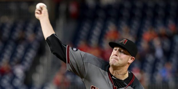 Arizona Diamondbacks starting pitcher Archie Bradley (25) pitches during the first inning of a base...