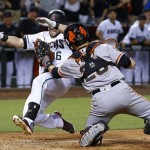 San Francisco Giants' Buster Posey, right, tags out Arizona Diamondbacks' Chris Owings, as Owings tried to score during the seventh inning of a baseball game Friday, Sept. 9, 2016, in Phoenix. (AP Photo/Ross D. Franklin)