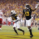 Arizona State's Armand Perry (13) and Maurice Chandler (8) celebrate a safety against Texas Tech as Texas Tech's Baylen Brown (65) and Justin Murphy (73) walk off the field during the first half of an NCAA college football game Saturday, Sept. 10, 2016, in Tempe, Ariz. (AP Photo/Ross D. Franklin)