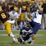 Northern Arizona's Griffin Roehler (14) kicks a field goal from the hold of Hunter Burton (87) as Arizona State's De'Chavon Hayes (8) arrives late during the first half of an NCAA college football game Saturday, Sept. 3, 2016, in Tempe, Ariz. (AP Photo/Ross D. Franklin)