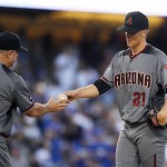 Arizona Diamondbacks starting pitcher Zack Greinke, right, is taken out of the game by manager Chip Hale during the fifth inning of a baseball game against the Los Angeles Dodgers, Monday, Sept. 5, 2016, in Los Angeles. (AP Photo/Mark J. Terrill)