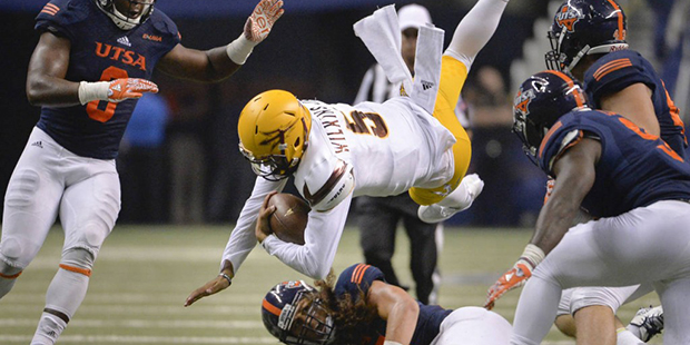 Arizona State quarterback Manny Wilkins (5) is taken down by UTSA defenders during the second half ...