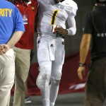 Grambling State quarterback DeVante Kincade (1) limps to the bench during the second half of an NCAA college football game against Arizona, Saturday, Sept. 10, 2016, in Tucson, Ariz. Arizona defeated Grambling State 31-21. (AP Photo/Rick Scuteri)
