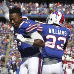 Buffalo Bills Aaron Williams (23) celebrates his touchdown with quarterback Tyrod Taylor (5) during the second half of an NFL football game on Sunday, Sept. 25, 2016, in Orchard Park, N.Y. Williams scored after Arizona lost the ball after it was snapped the ball high on a field goal attempt. (AP Photo/Jeffrey T. Barnes)