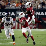Arizona Cardinals tight end Hakeem Valles (89) pulls in a pass as Denver Broncos defensive back Taurean Nixon (39) defends during the first half of an NFL preseason football game, Thursday, Sept. 1, 2016, in Glendale, Ariz. (AP Photo/Ross D. Franklin)