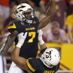 Arizona State's Kalen Ballage (7) celebrates a touchdown against Texas Tech with Sam Jones, right, during the first half of an NCAA college football game Saturday, Sept. 10, 2016, in Tempe, Ariz. (AP Photo/Ross D. Franklin)