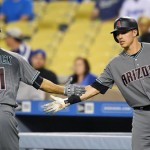 Arizona Diamondbacks' A.J. Pollock, left, is congratulated by Jake Lamb after hitting a solo home run during the first inning of a baseball game, against the Los Angeles Dodgers on Tuesday, Sept. 6, 2016, in Los Angeles. (AP Photo/Mark J. Terrill)