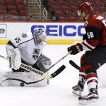 Los Angeles Kings' Jack Flinn (65) makes a save on a shot by Arizona Coyotes' Michael Bunting (58) during the second period of an NHL rookies hockey game Tuesday, Sept. 20, 2016, in Glendale, Ariz. (AP Photo/Ross D. Franklin)