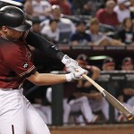Arizona Diamondbacks' Brandon Drury hits an RBI double against the Colorado Rockies during the fifth inning of a baseball game Wednesday, Sept. 14, 2016, in Phoenix. (AP Photo/Ross D. Franklin)