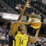 Indiana Fever's Tamika Catchings (24) is fouled by Phoenix Mercury's DeWanna Bonner (24) as she goes up for a shot during the first half of a first round WNBA playoff basketball game, Wednesday, Sept. 21, 2016, in Indianapolis. (AP Photo/Darron Cummings)