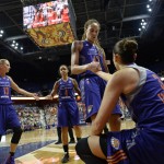 Phoenix Mercury's Brittney Griner helps teammate Diana Taurasi up off the court during the first half of a WNBA basketball game against the Connecticut Sun, Friday, Sept. 2, 2016, in Uncasville, Conn. (AP Photo/Jessica Hill)