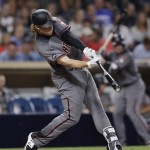 Arizona Diamondbacks' Kyle Jensen hits an RBI-triple during the seventh inning of a baseball game against the San Diego Padres on Monday, Sept. 19, 2016, in San Diego. (AP Photo/Gregory Bull)