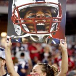 A New England Patriots fan holds up a Tom Brady picture prior to an NFL football game against the Arizona Cardinals, Sunday, Sept. 11, 2016, in Glendale, Ariz. (AP Photo/Ross D. Franklin)