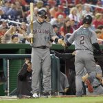 Arizona Diamondbacks' Jean Segura (2) is greeted by Paul Goldschmidt (44) after Segura hit a home run during the first inning of a baseball game against the Washington Nationals, Tuesday, Sept. 27, 2016, in Washington. (AP Photo/Nick Wass)