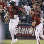 Arizona Diamondbacks' Brandon Drury (27) is showered with water by teammate Chris Owings after his game winning RBI single against the Los Angeles Dodgers during the 12th inning of a baseball game, Sunday, Sept. 18, 2016, in Phoenix. The Diamondbacks defeated the Dodgers 10-9. (AP Photo/Ralph Freso)