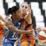 Minnesota Lynx's Maya Moore, left, passes the ball as Phoenix Mercury's Diana Taurasi defends in the second half of a WNBA playoff semi-finals basketball game Wednesday, Sept. 28, 2016, in St. Paul, Minn. The Lynx won 113-95. Taurasi led the Mercury with 25 points while Moore score 31 to lead the Lynx. (AP Photo/Jim Mone)