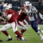 Arizona Cardinals quarterback Carson Palmer (3) is sacked by New England Patriots defensive end Trey Flowers (98) during an NFL football game, Sunday, Sept. 11, 2016, in Glendale, Ariz. (AP Photo/Ross D. Franklin)