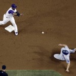 Arizona Diamondbacks' Jean Segura, left, throws to first after forcing out Los Angeles Dodgers' Corey Seager on a double play hit into by Justin Turner during the third inning of a baseball game, Thursday, Sept. 15, 2016, in Phoenix. (AP Photo/Matt York)