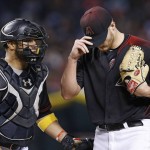 Arizona Diamondbacks' Shelby Miller, right, pauses as catcher Welington Castillo, left, talks with the pitcher during the sixth inning of a baseball game against the Los Angeles Dodgers Saturday, Sept. 17, 2016, in Phoenix. The Dodgers defeated the Diamondbacks 6-2. (AP Photo/Ross D. Franklin)
