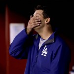 Los Angeles Dodgers starting pitcher Rich Hill stands in the dugout after being pulled during the sixth inning of a baseball game against the Arizona Diamondbacks, Thursday, Sept. 15, 2016, in Phoenix. (AP Photo/Matt York)